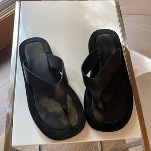 The Row lifted sandals.